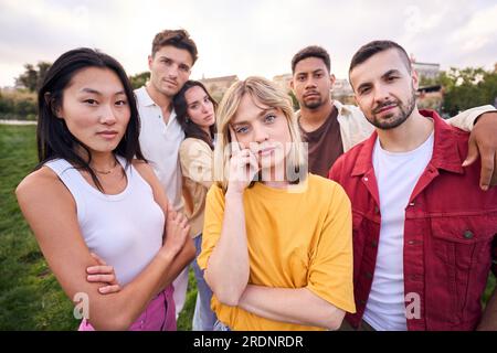 Taking life very seriously. Group of casually dressed young adults looking serious at the camera. Stock Photo