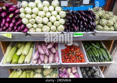 Various vegetables - zucchini, eggplant, tomato, chinese cabbage on the counter for sale in the market Stock Photo