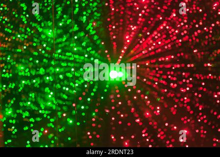 background of green and red bokeh light, diverge from the center of the frame Stock Photo