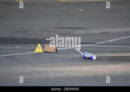 Newark, United States. 22nd July, 2023. Evidence markers seen at the crime scene in Newark. Authorities investigate a shooting at a parking lot outside Marbella Lounge nightclub on Broadway in Newark. The shooting happened around 3:15 AM, Saturday morning. One man was confirmed dead by the Essex County Prosecutor's Office. There is no word on if any suspects were captured. The Essex County Prosecutor's Office is investigating the shooting. (Photo by Kyle Mazza/SOPA Images/Sipa USA) Credit: Sipa USA/Alamy Live News Stock Photo