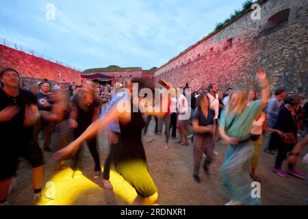 Koblenz, Germany. 22nd July, 2023. World music fans dance up within the walls of Ehrenbreitstein Fortress at the world music festival 'Horizons'. The festival presents modern varieties of world music from all continents. Credit: Thomas Frey/dpa/Alamy Live News Stock Photo