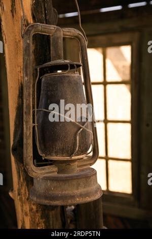 A dusty old latern hangs in an old building on display at the Little Hollywood Movie Museum in Kanab, Utah. Stock Photo