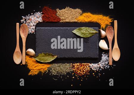Set of Various spices on black stone table. Top view with copy space. Stock Photo