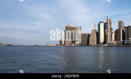 Skyline of Manhattan from Brooklyn Bridge Park, a park on the Brooklyn side of the East River in New York City Stock Photo