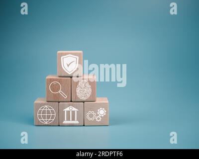 icon on a wooden cube Represents data theft protection Security in business teams Stock Photo