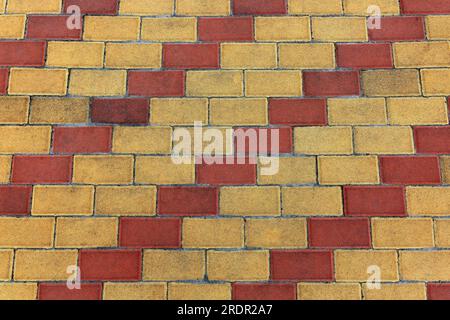 Image background of laid street parquet in yellow and red Stock Photo