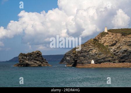 Colourful Sea View with Detail of the Harbour Wall and ‘Monkey House’ Look Out Hut, Cliffs Striation and Light Ocean Swell. Portreath, Cornwall. Stock Photo