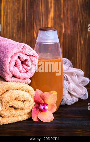 Shower gel bottle on the table among bathing accessories Stock Photo