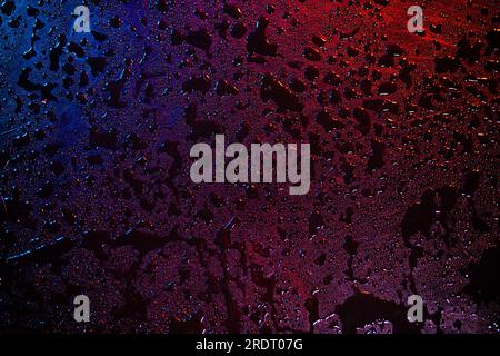 Abstract wet surface with red and blue lights Stock Photo