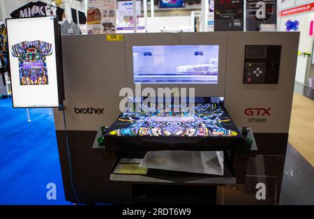 Bangkok, Thailand - June 6, 2023: Sublimation printer printing T shirt show in Garment and Textile Manufacturing Industry. Stock Photo