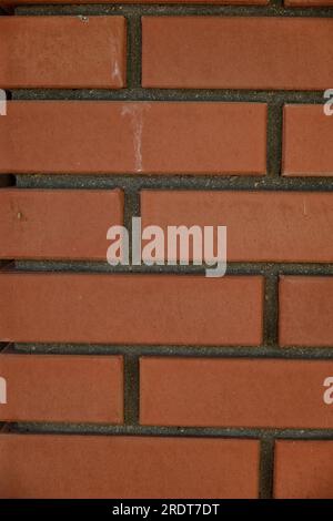 Red brick and brick edge from pillar in front of wall as texture background Stock Photo