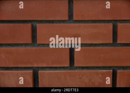 Red brick and brick edge from pillar in front of wall as texture background Stock Photo