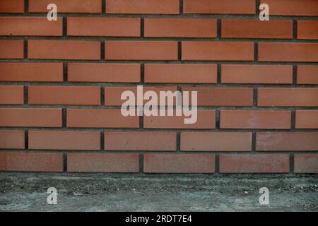 Red brick and brick edge from pillar in front of wall as texture background Stock Photo