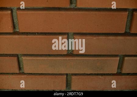 Red brick and brick edge from pillar in front of wall as texture background Stock Photo