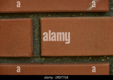 Red brick and brick edge from pillar in front of wall as texture background Stock Photo