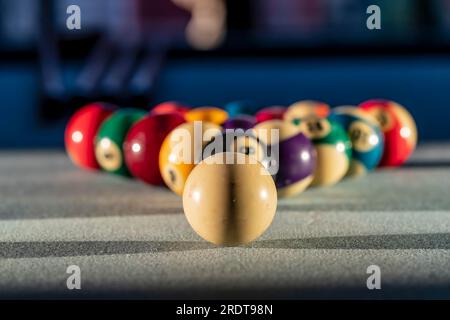 A racked up triangle of billiard balls on the table, ready for a game of pool Stock Photo
