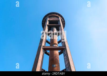 old rusty water tower and clear blue sky Stock Photo - Alamy