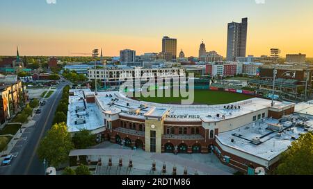 Parkview Field Tin Caps baseball diamond summer sunrise downtown Forty Wayne skyscraper skyline Stock Photo