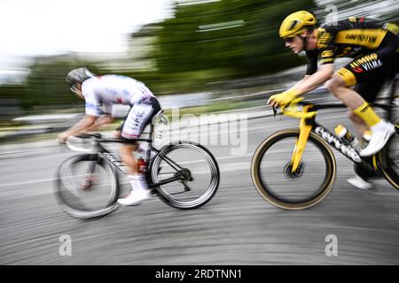 Paris, France. 23rd July, 2023. Illustration picture shows, Slovenian Tadej Pogacar of UAE Team Emirates and Belgian Nathan Van Hooydonck of Jumbo-Visma in action during the 21st and last stage of the Tour de France cycling race, from Saint-Quentin-en-Yvelines to Paris, France, Sunday 23 July 2023. This year's Tour de France takes place from 01 to 23 July 2023. BELGA PHOTO JASPER JACOBS Credit: Belga News Agency/Alamy Live News Stock Photo