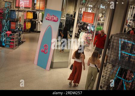 A poster announcing the Barbie advertising campaign seen at PRIMARK store on Gran Vía street in Madrid for the premiere of a new movie of the world-renowned doll. Stock Photo