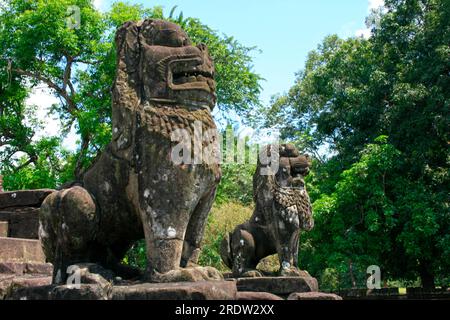 Lion statues at Bakong, the first temple mountain of sandstone constructed by rulers of the Khmer empire at Angkor near modern Siem Reap in Cambodia. Stock Photo