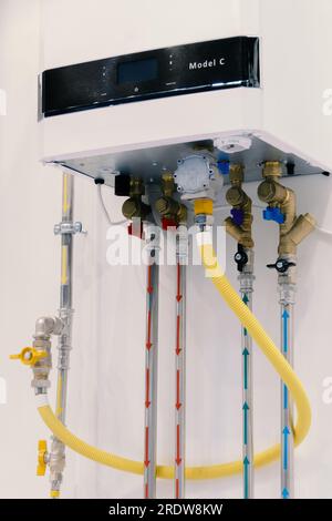 Home heating and water heating system. Double boiler. Connecting pipes to the heating boiler Stock Photo