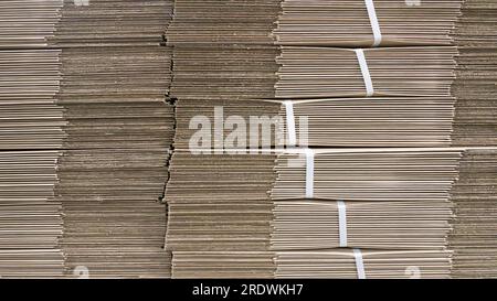 corrugated cardboard for packing, Pile of corrugated cardboard sheets and ready to use, Corrugated cardboard sheets Stock Photo