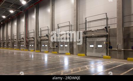 truck at loading ramps of a warehouse. Delivery logistics concept background Stock Photo