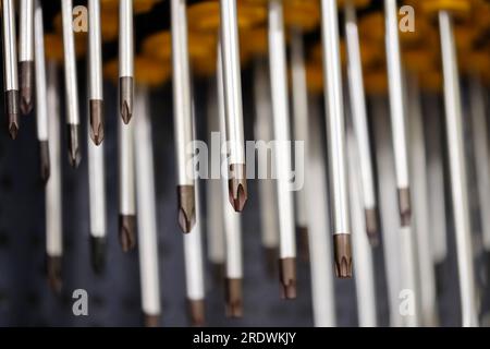 Slotted screw driver and phillips screw driver, Close up Screwdriver, metal tool, plastic handle, orange black Stock Photo