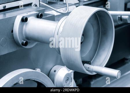 Lathe control knobs close up blue tone. Metal machine tools industry. The metalworking process by turning machine. industry metal processing concept b Stock Photo