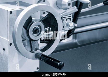 Lathe control knobs close up blue tone. Metal machine tools industry. The metalworking process by turning machine. industry metal processing concept b Stock Photo