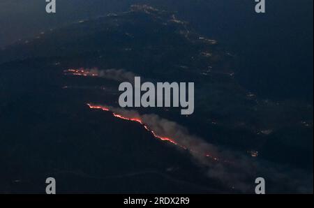 Griechenland, India. 22nd July, 2023. The forest fires on the island of Rhodes can be seen from an airplane. Almost 20,000 people are fleeing severe forest fires on Rhodes, including many tourists. Credit: Britta Pedersen/dpa/Alamy Live News Stock Photo