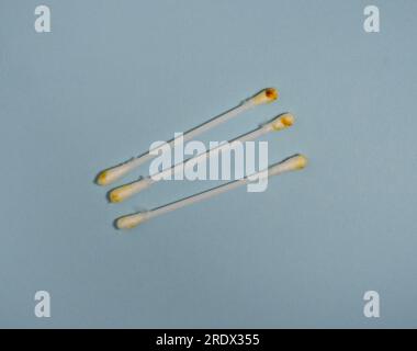 Dirty cotton swabs. Earwax on cotton swabs. Personal hygiene. Dirt from the ears. Medicine. Hygiene accessories. Discharge . Ear cleaning concept Stock Photo