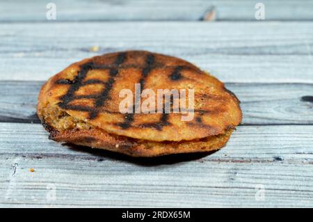 Traditional Egyptian dish Hawawshi, pita stuffed with chicken and spiced with onions, pepper, parsely and chilies, baked by filling flat Egyptian brea Stock Photo