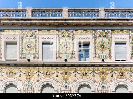 Mosaics on the façade of 'Palazzo del Governo' building,now house of the Prefecture, in piazza Unità d'Italia, Trieste city center, Italy Stock Photo