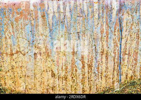 Concrete wall with streaks of blue and brown chemical erosion textured background asset Stock Photo
