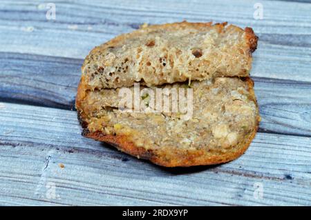 Traditional Egyptian dish Hawawshi, pita stuffed with chicken and spiced with onions, pepper, parsely and chilies, baked by filling flat Egyptian brea Stock Photo