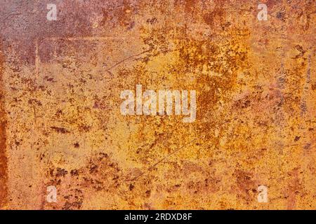 Abstract orange and yellow metal rusting background asset, brown flaking paint Stock Photo