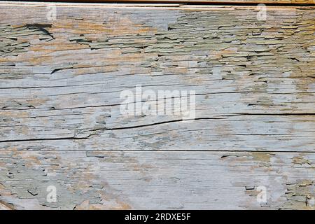 Cracked, splintered, wood wall, gray fading paint, abstract background asset Stock Photo