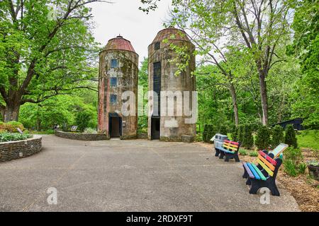 Two silos standing out in woodland park trail at Bernheim Forest Stock Photo