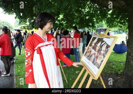 Dublin, Ireland. 23rd July, 2023. An Irish woman is seen during an event of 'Chinese Culture in a Van' in Dublin, Ireland, July 23, 2023. The annual event designed to promote the Chinese culture in Ireland was held in Dublin on Sunday, drawing hundreds of local residents. Credit: Zhao Tianyu/Xinhua/Alamy Live News Stock Photo