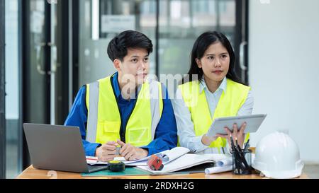 Civil engineers and architects listening brief from the chief Stock Photo