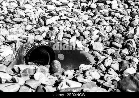 underground drainage storm drain with winged walls surrounded by rock for erosion control  Stock Photo