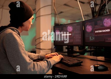 System hacked warning, it specialist solving cyberattack problem, computer security technology, data breach. Hacker accessing database server, cybersecurity, internet virus Stock Photo