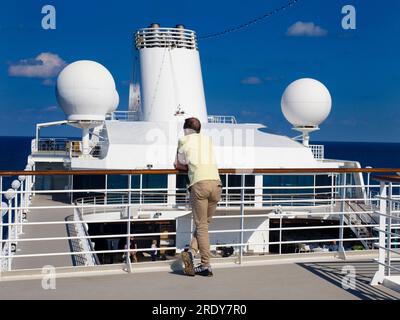 In a famous laconic song, Noel Coward told us that 'only mad dogs and Englishmen' go out in the midday sun. Not altogether accurate, as we can see fro Stock Photo