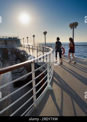 Running tracks are my secret weapon and favoured shooting venue when on board cruise liners. Not only does slogging around them help in the fight agai Stock Photo