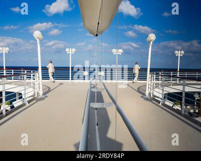 Running tracks are my secret weapon and favoured shooting venue when on board cruise liners. Not only does slogging around them help in the fight agai Stock Photo