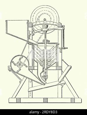 An old engraving of a large grain hulling machine of the 1800s. It is from a Victorian mechanical engineering book of the 1880s. Grains such as rice required a huller or husker to mechanically remove the chaff (the outer husks) of the grains. Traditionally, it would be pounded using some form of mortar and pestle. The Engelberg huller, designed by German Brazilian engineer Evaristo Engelberg in Brazil and first patented in 1885, used steel rollers to remove the husk. Here the huller uses abrasive rotating conical abrasive disks to first remove the husks. Stock Photo