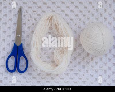 Scandinavian gnome with long beard red hat white knit background step by step handmade tutorial. Homemade fabric swedish Christmas decoration DIY. Hob Stock Photo