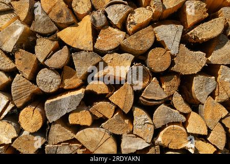 Firewood for kindling background. Harvesting wood for a fireplace for the winter in the house. High quality photo Stock Photo